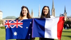 Australian and French students holding flags on campus