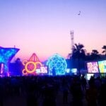 Futuristic festival with colorful lights and diverse crowd